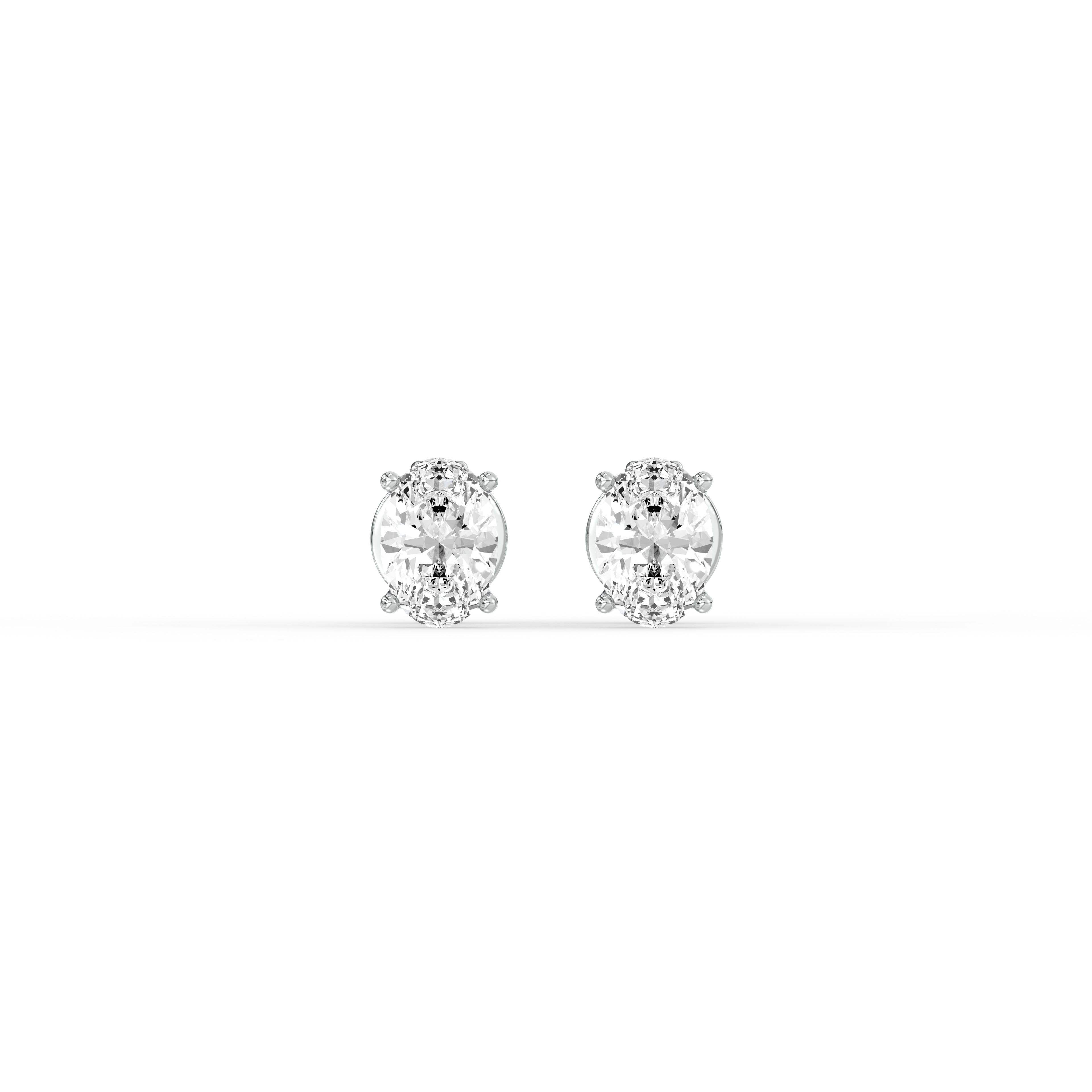 OVAL DIAMOND PLATINUM EAR STUDS - ( 0.72CT) featuring elegant oval-cut diamonds in a classic prong setting.
