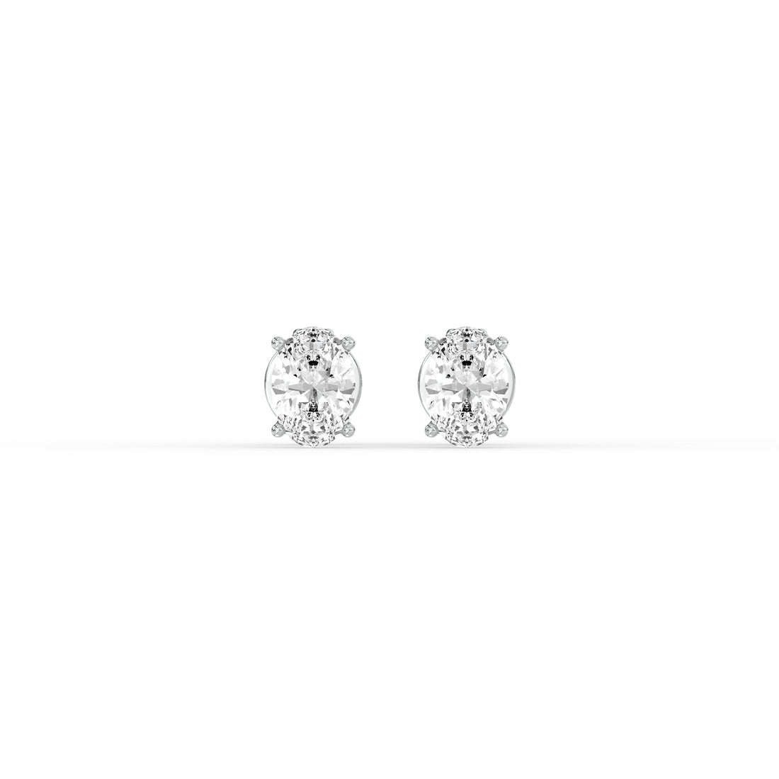 OVAL DIAMOND PLATINUM EAR STUDS - ( 0.72CT) featuring elegant oval-cut diamonds in a classic prong setting.