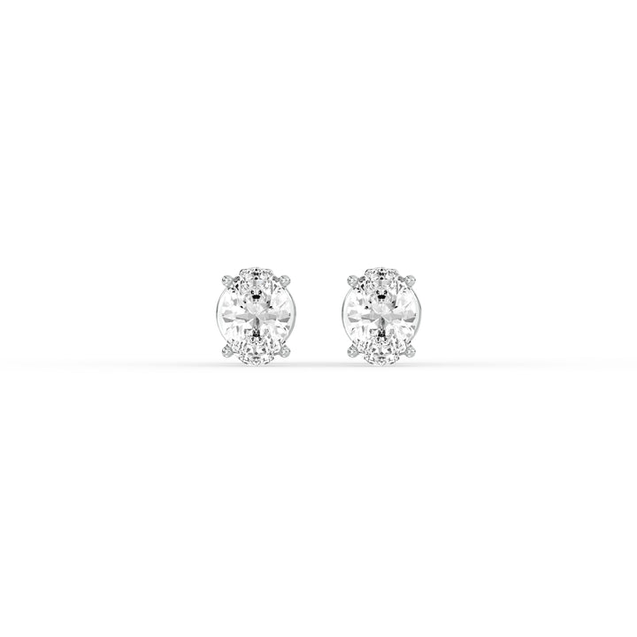 OVAL DIAMOND PLATINUM EAR STUDS - ( 0.72CT) featuring elegant oval-cut diamonds in a classic prong setting.