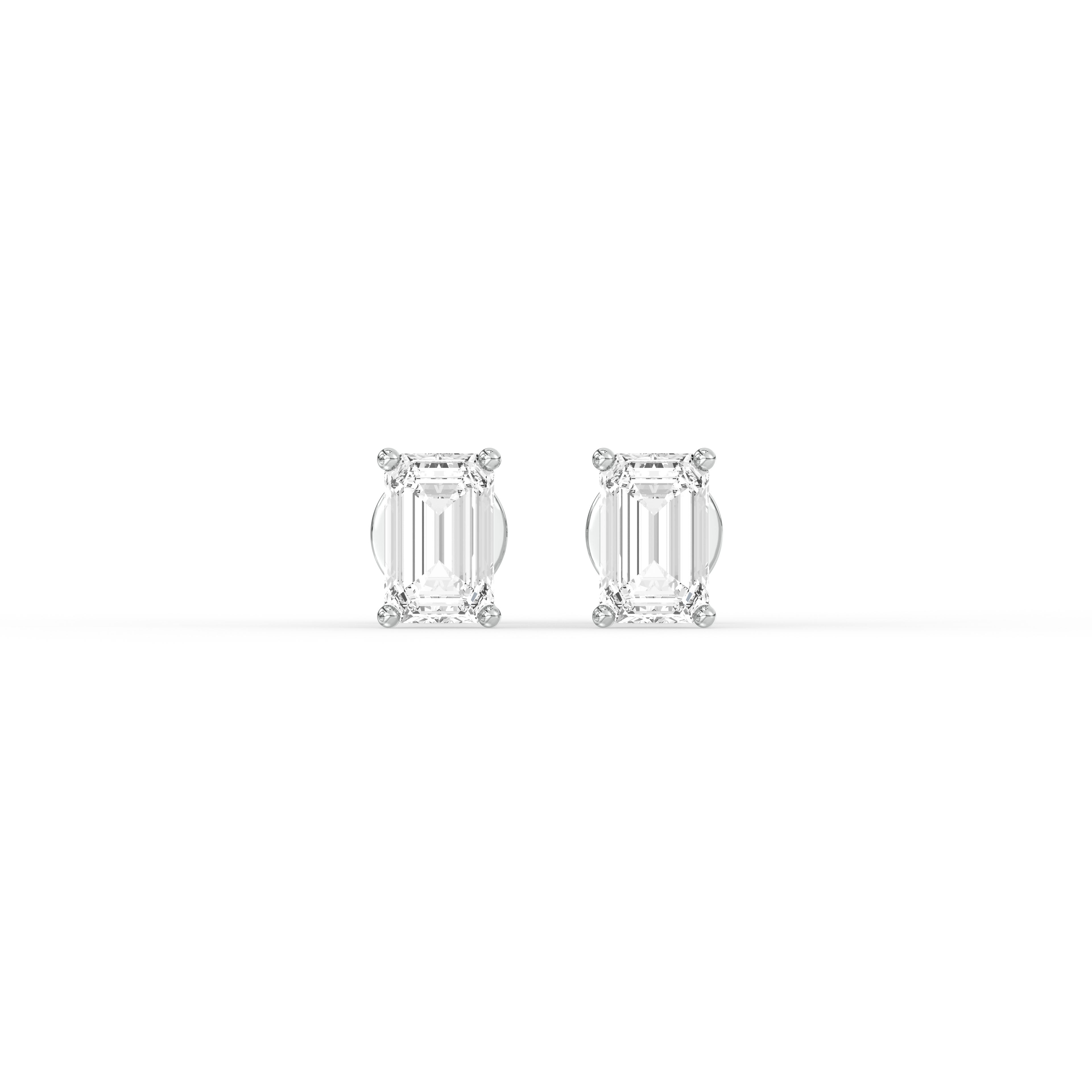 EMERALD DIAMOND PLATINUM EAR STUDS - ( 0.86CT) featuring emerald-cut diamonds in polished platinum settings.