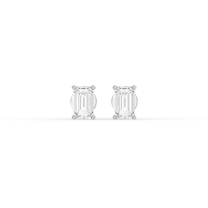 EMERALD DIAMOND PLATINUM EAR STUDS - ( 0.86CT) featuring emerald-cut diamonds in polished platinum settings.
