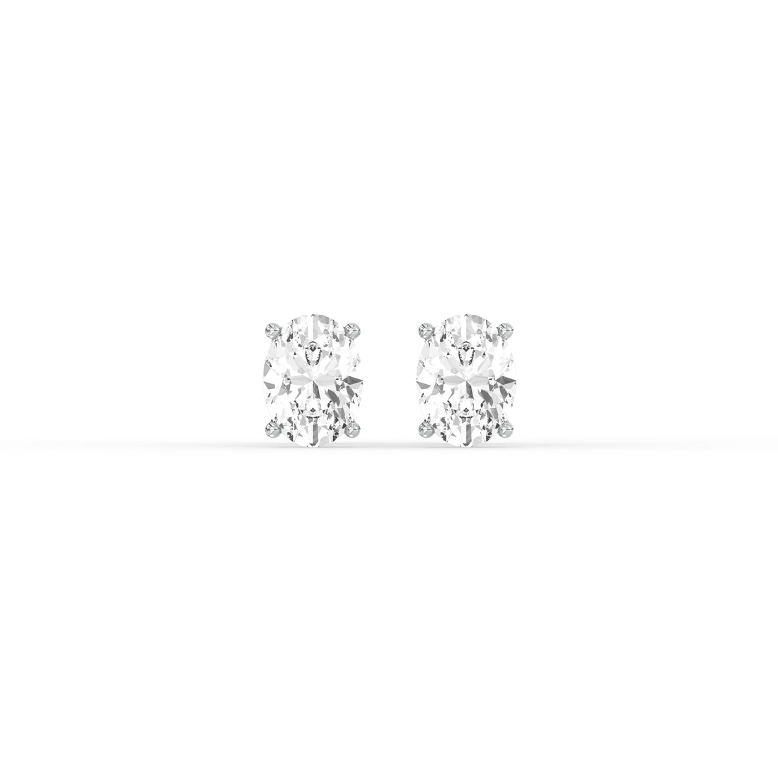 OVAL DIAMOND PLATINUM EAR STUDS - ( 1CT) featuring oval-cut diamonds in a classic prong setting.