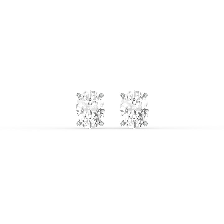 OVAL DIAMOND PLATINUM EAR STUDS - ( 1CT) featuring oval-cut diamonds in a classic prong setting.