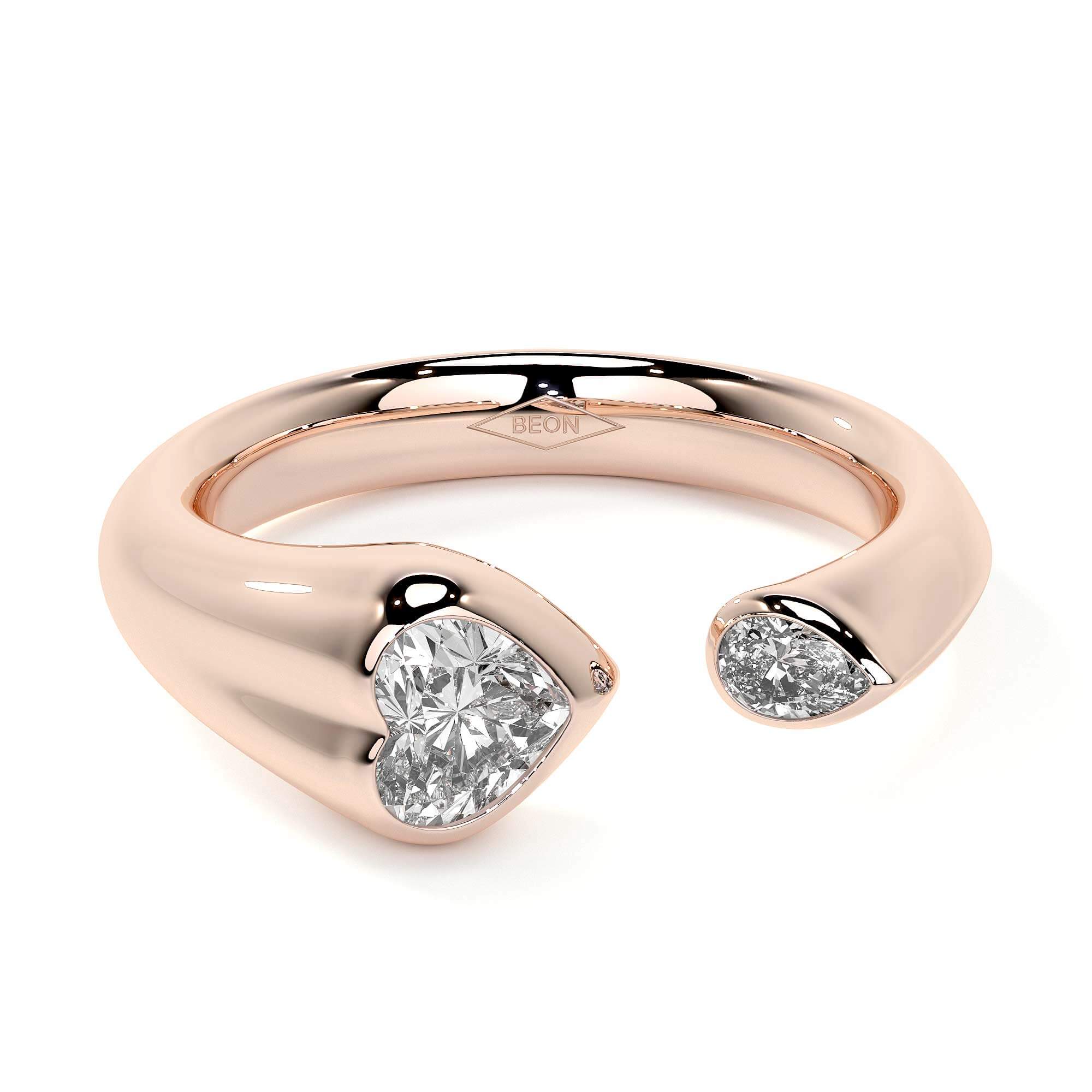 Sculpted Unity Ring featuring a heart and pear-shaped diamond in a fluid rose gold band.