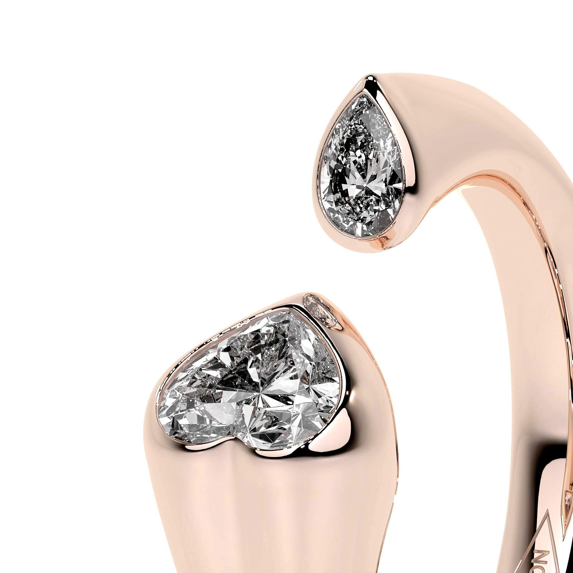Sculpted Unity Ring in rose gold with heart and pear-shaped diamonds showcasing contemporary elegance.