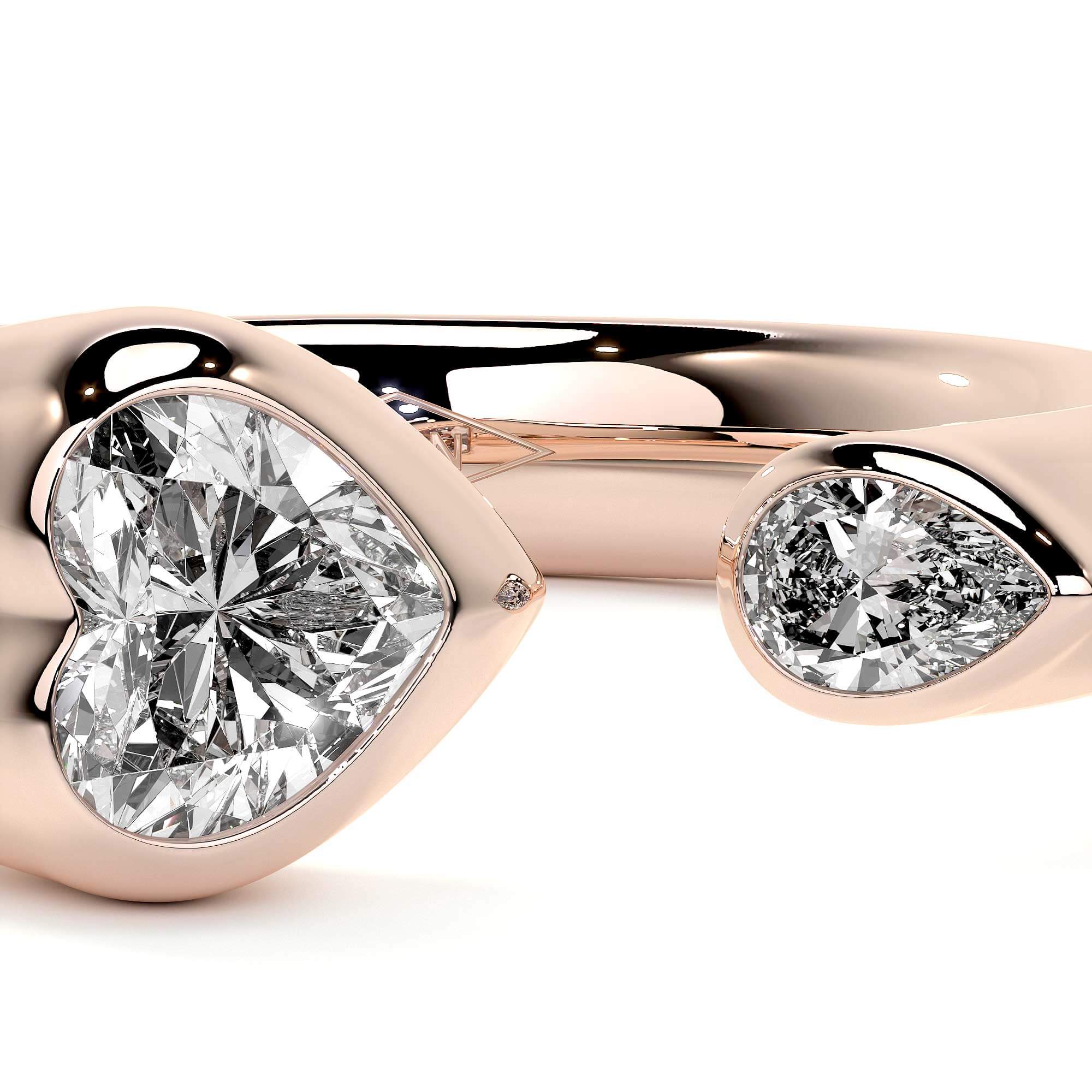 Sculpted Unity Ring featuring heart and pear-shaped diamonds in a rose gold band, showcasing contemporary elegance.