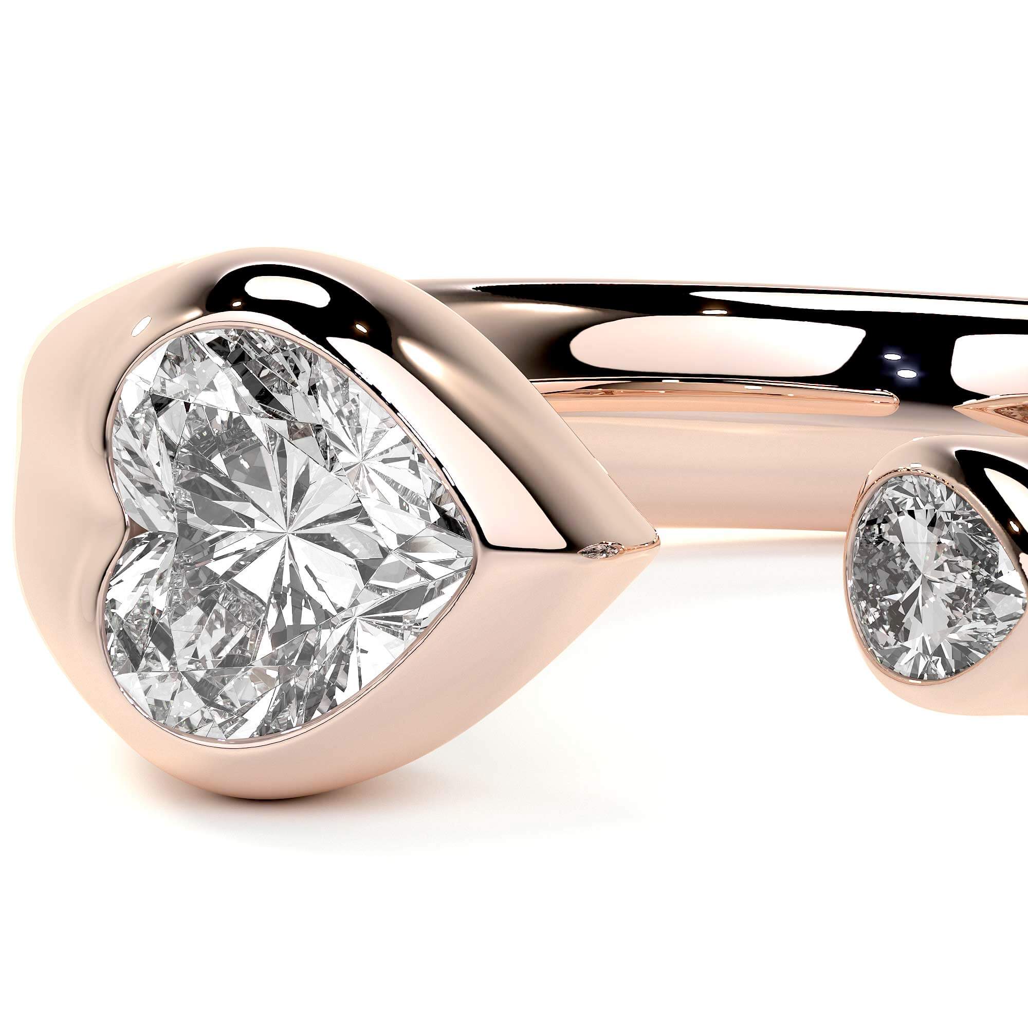Sculpted Unity Ring in rose gold featuring heart and pear-shaped diamonds on a fluid band.
