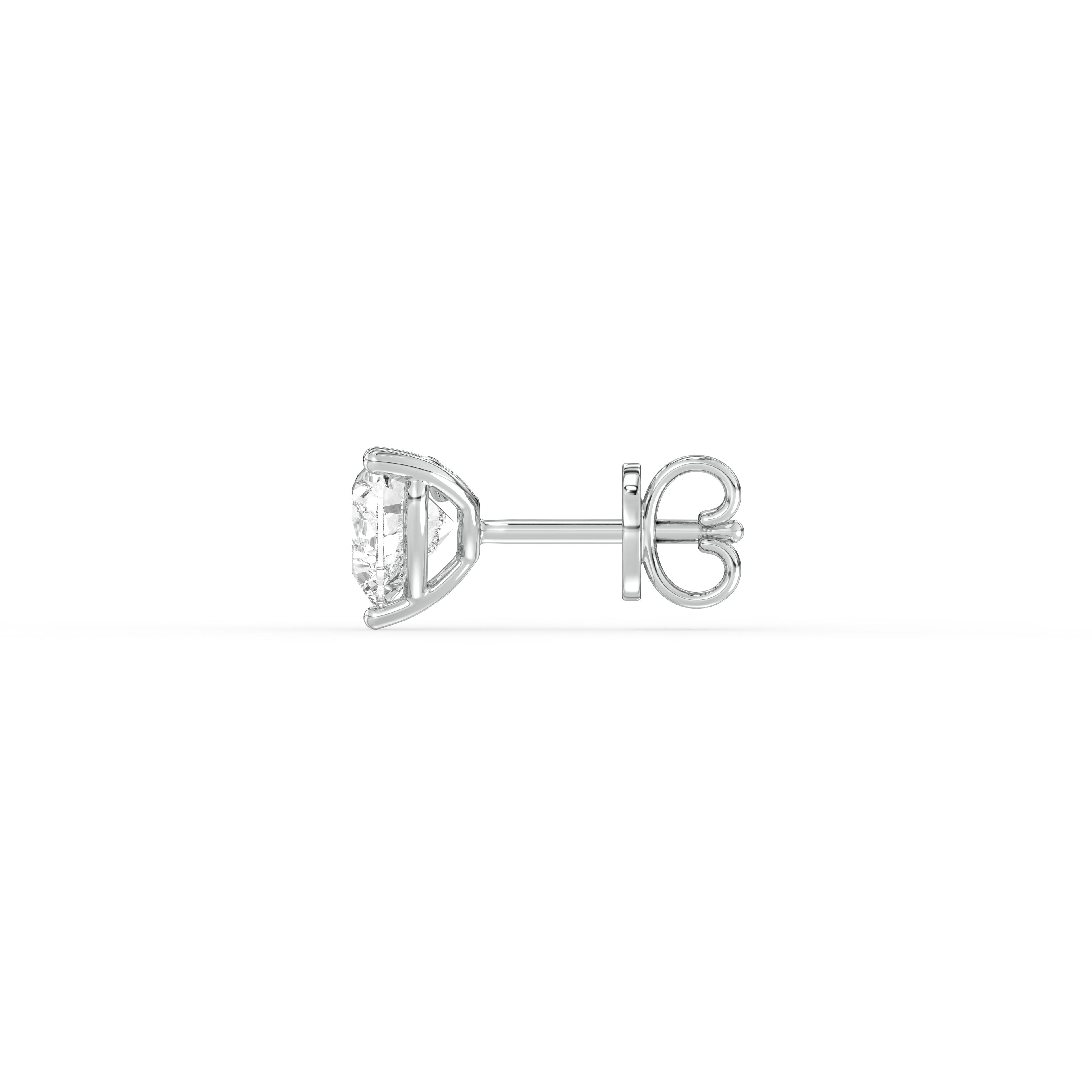 HEART DIAMOND PLATINUM EAR STUDS - ( 1CT) showcasing heart-shaped diamond in a sleek platinum setting.