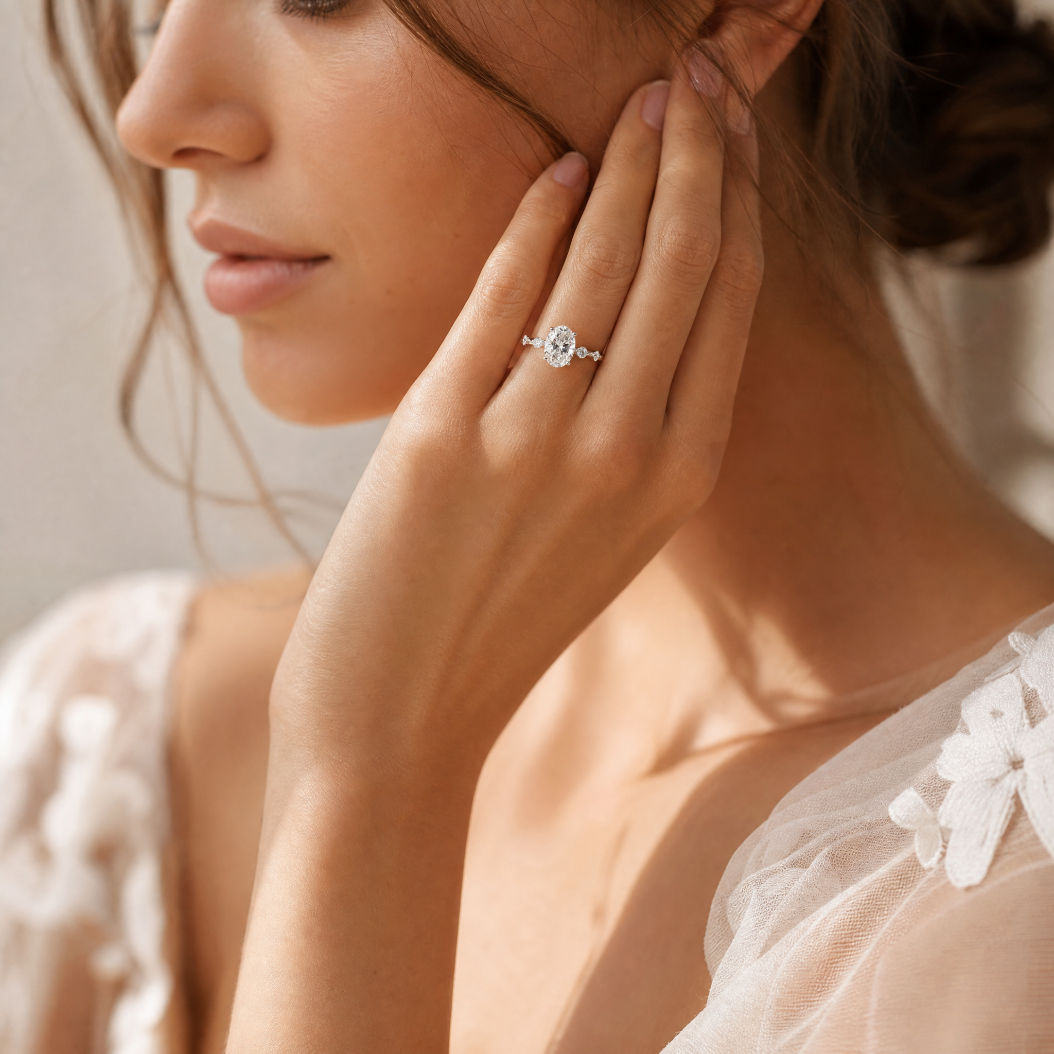 OVAL DIAMOND WITH SIDE DIAMONDS RING