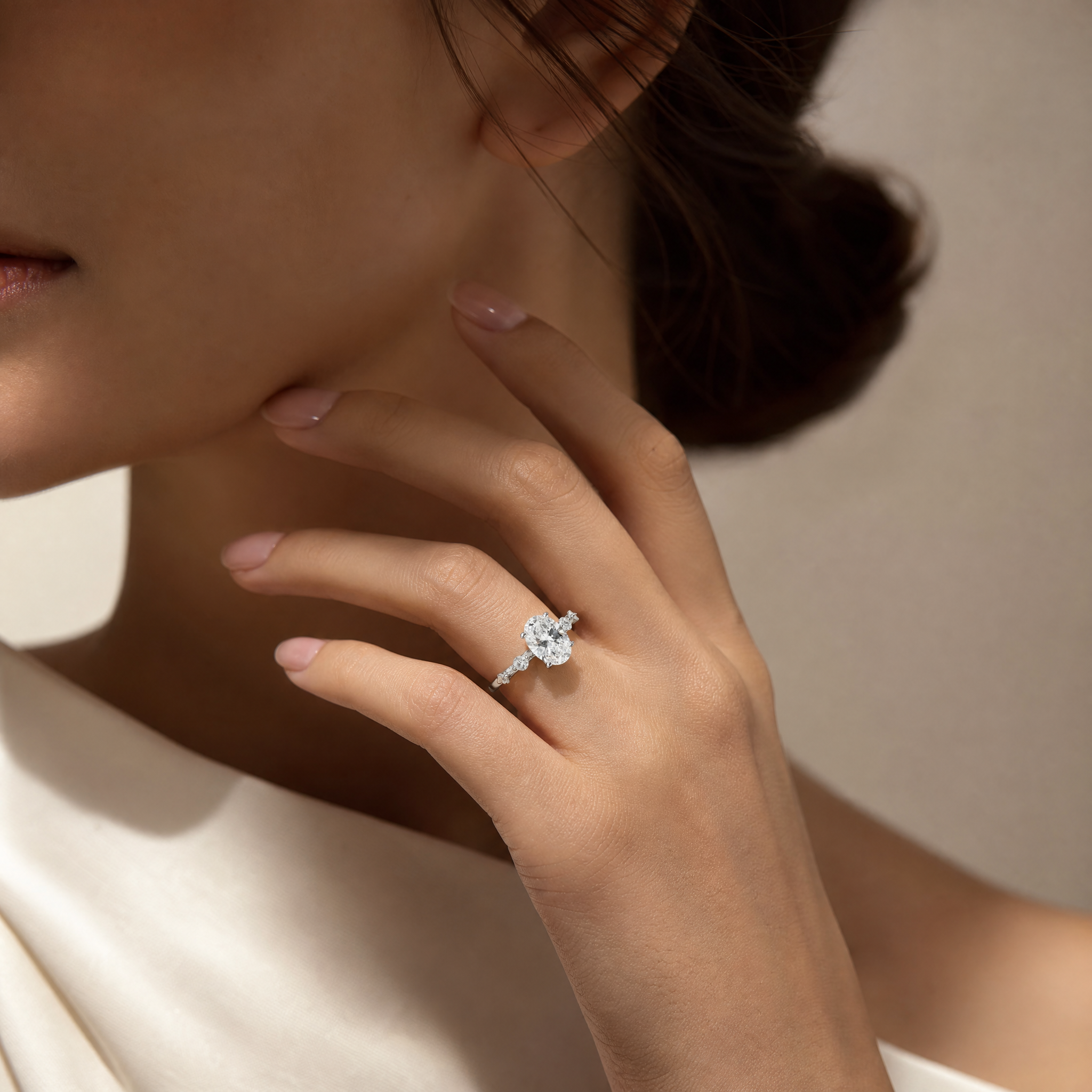 OVAL DIAMOND WITH SIDE DIAMONDS RING