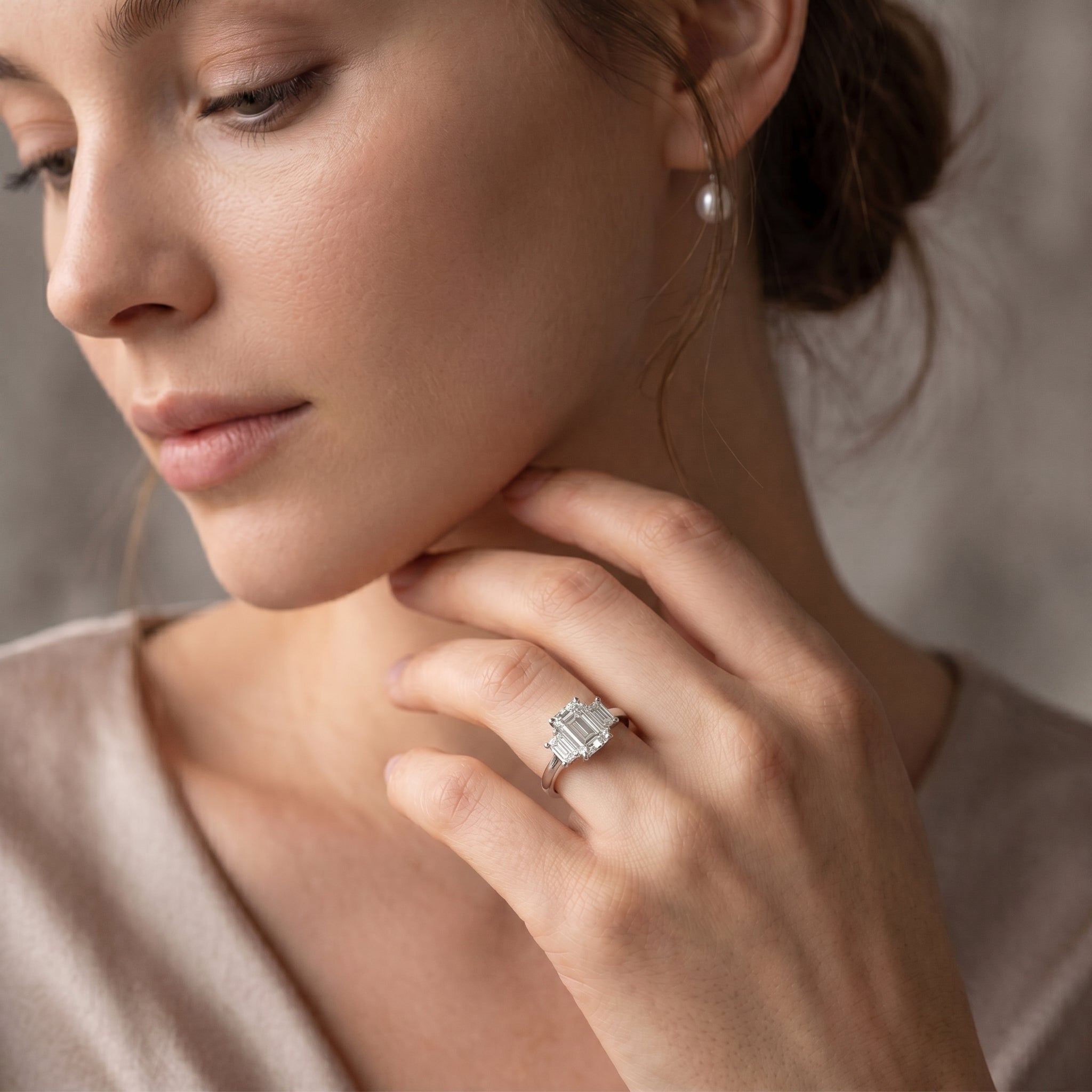 EMERALD CUT DIAMOND TRILOGY RING