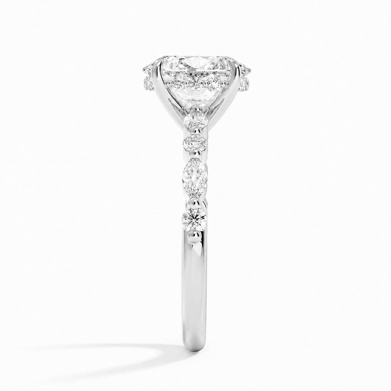 OVAL DIAMOND WITH SIDESTONES DIAMOND PAVE RING